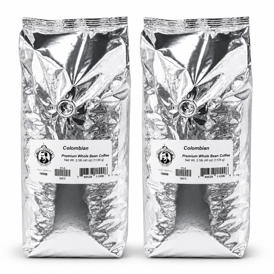 Two packages of Colombian Premium Whole Bean Coffee on a white background