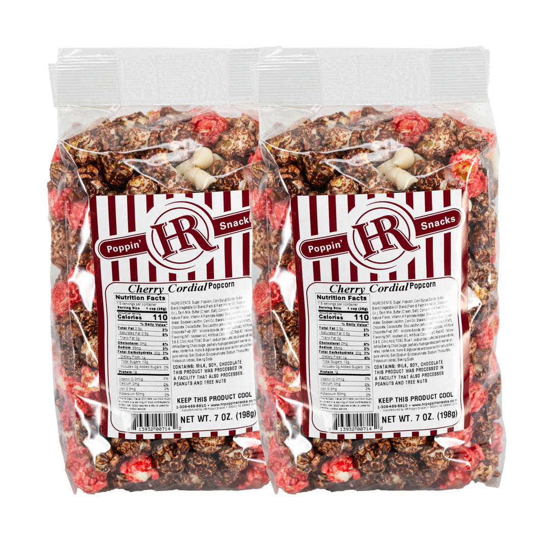 Two packages of Cherry Cordial Popcorn with visible branding and nutritional information.