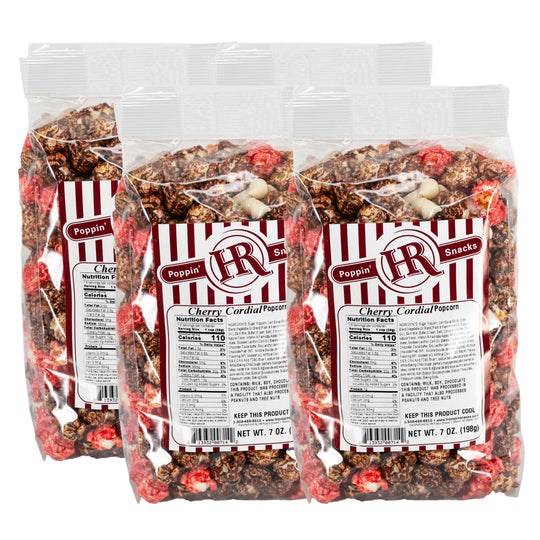 Four packages of Cherry Cordial Popcorn with visible branding and nutritional information.