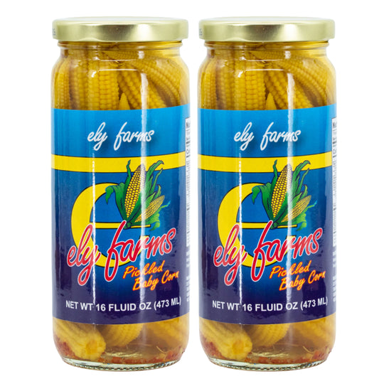 Two jars of Ely Farms pickled baby corn on a white background