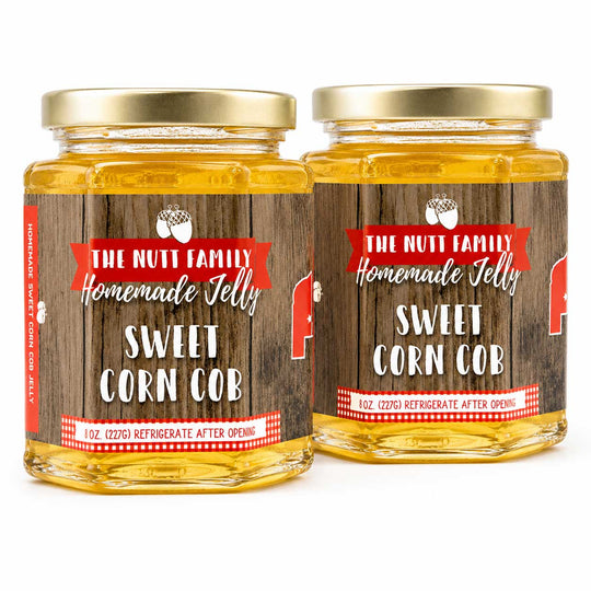 Two jars of 'The Nutt Family Homemade Jelly Sweet Corn Cob' on a white background