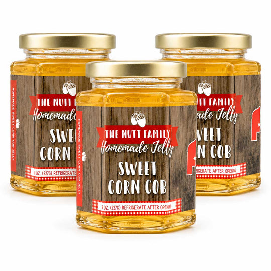 Three jars of 'The Nutt Family Homemade Jelly' Sweet Corn Cob on a white background