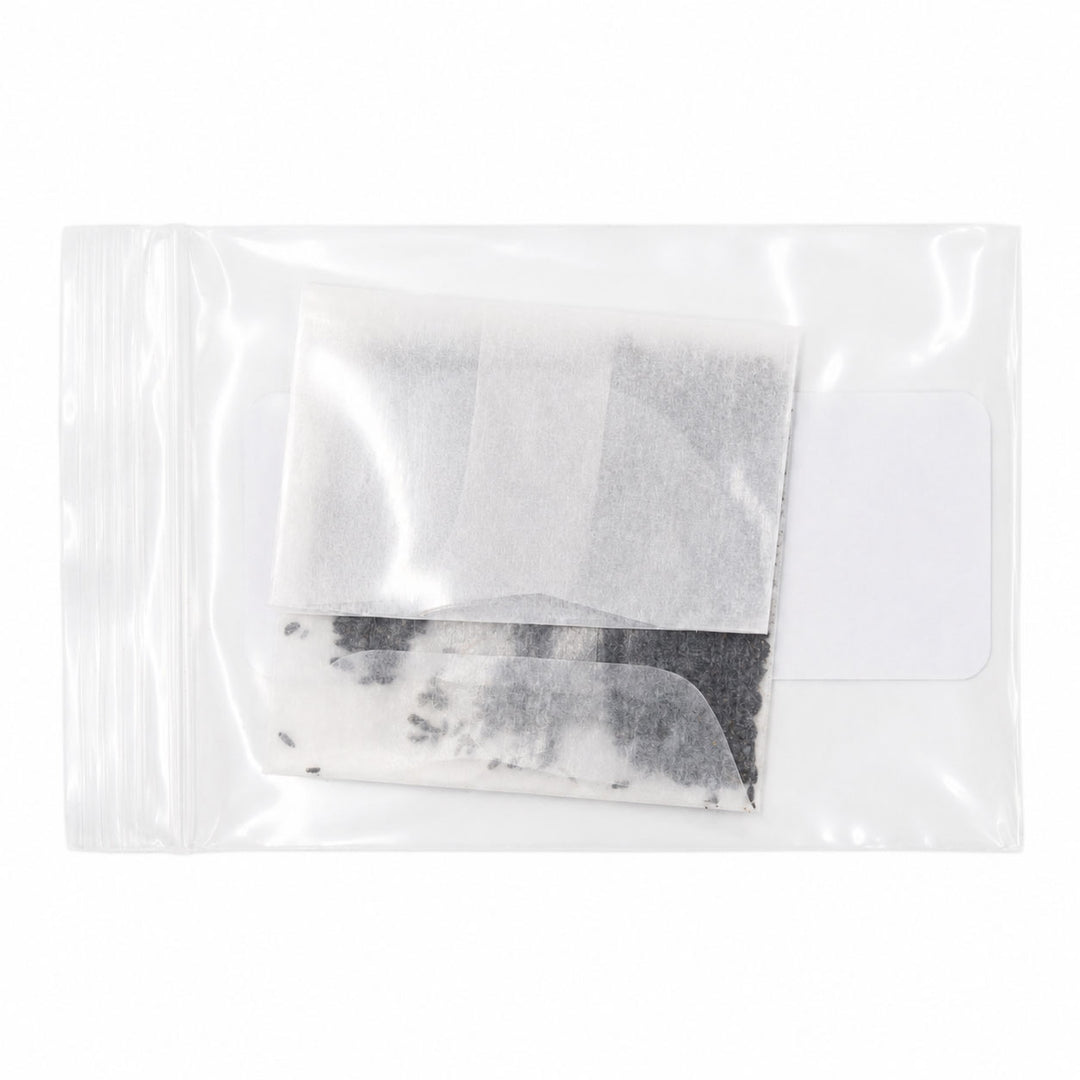 Tea bag in a clear plastic package on a white background