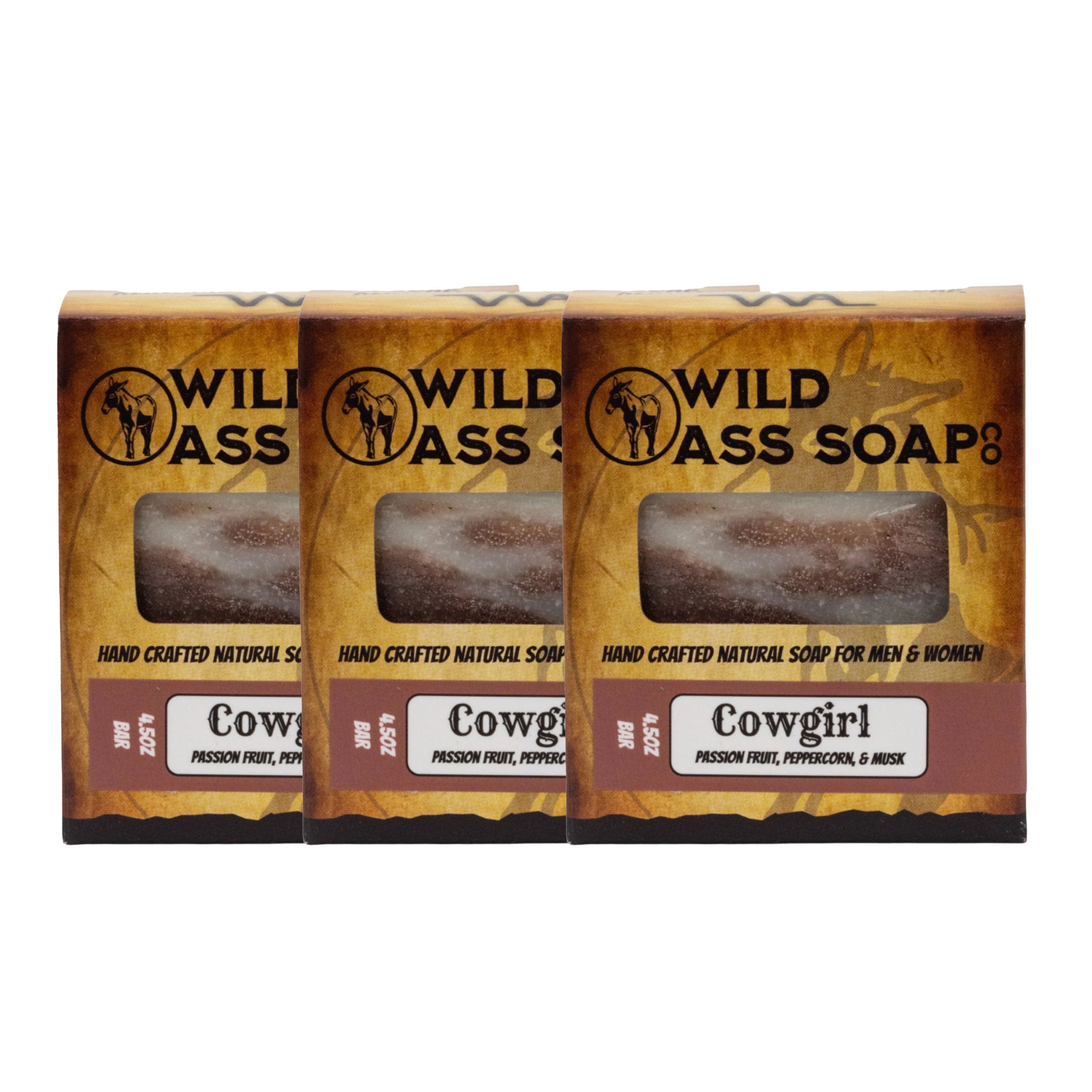 Three bars of Wild Ass Soap in packaging with 'Cowgirl' scent on a white background.