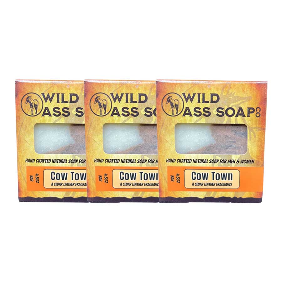 Three bars of Wild Ass Soap with 'Cow Town' fragrance on a white background