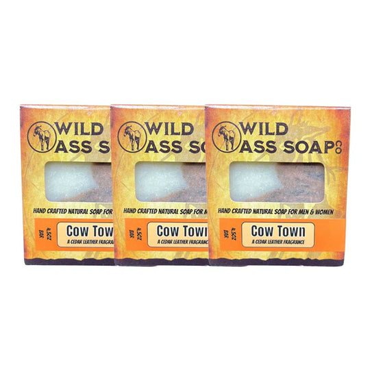 Three bars of Wild Ass Soap with 'Cow Town' fragrance on a white background