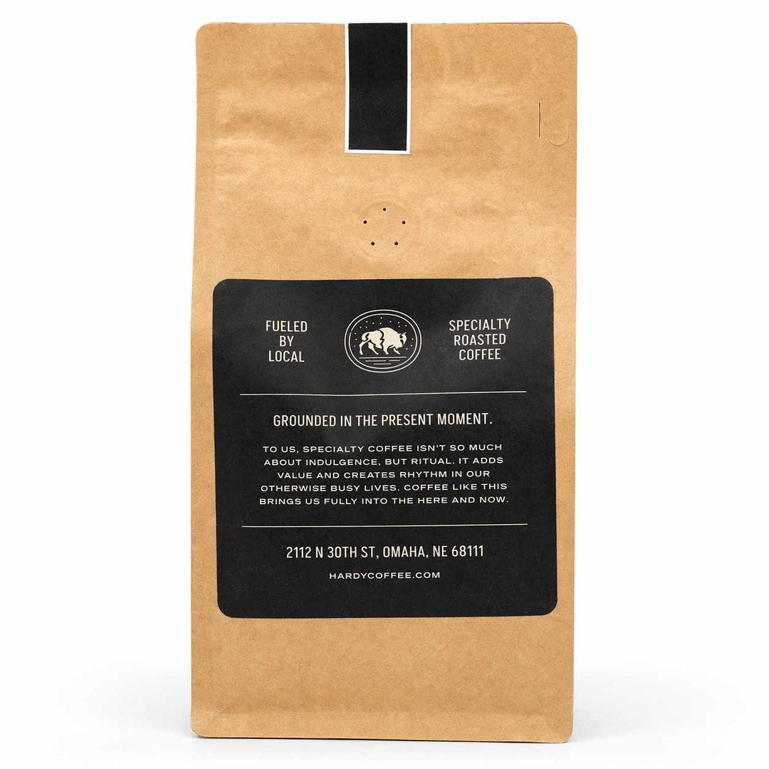 Kraft paper coffee bag with a black label on a white background