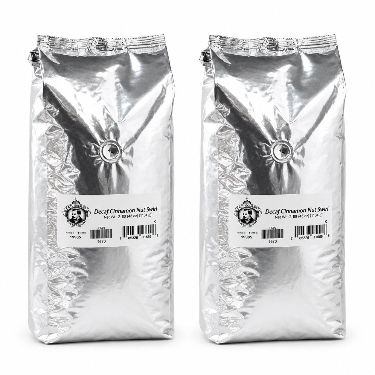 Two packages of Decaf Cinnamon Nut Swirl coffee on a white background