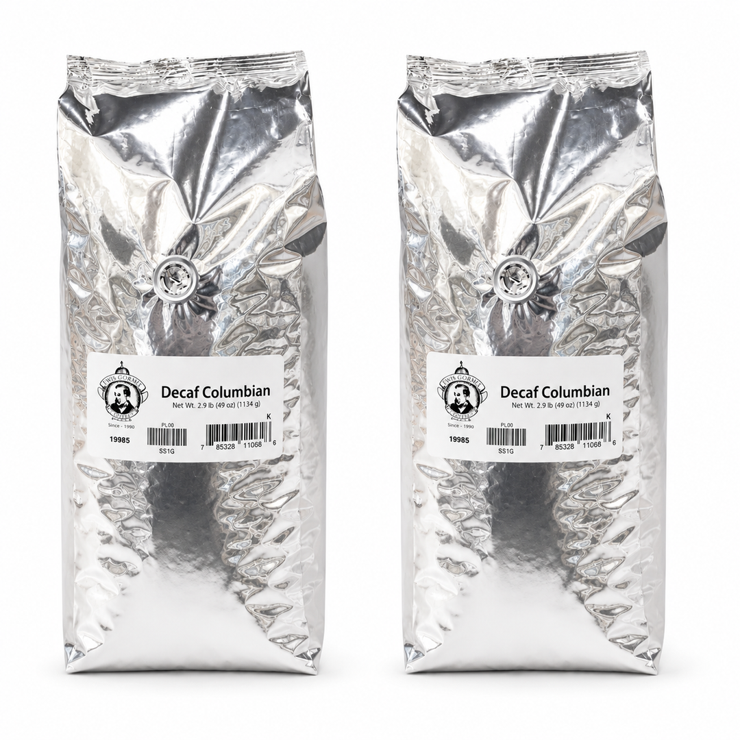 Two packages of Decaf Colombian coffee on a white background