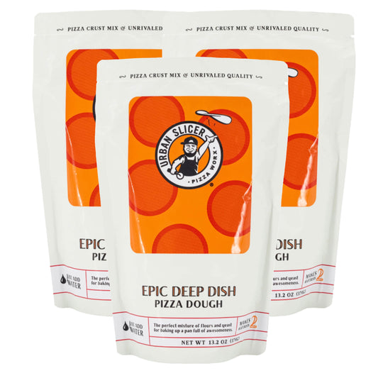 Three packages of Urban Slicers pizza dough with orange and white design.