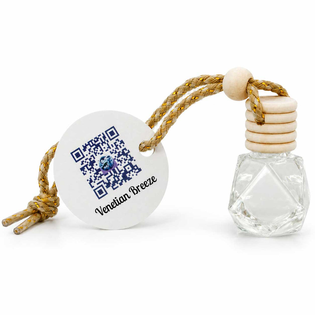 Clear glass bottle with wooden cap and white spherical container featuring QR code on a white background