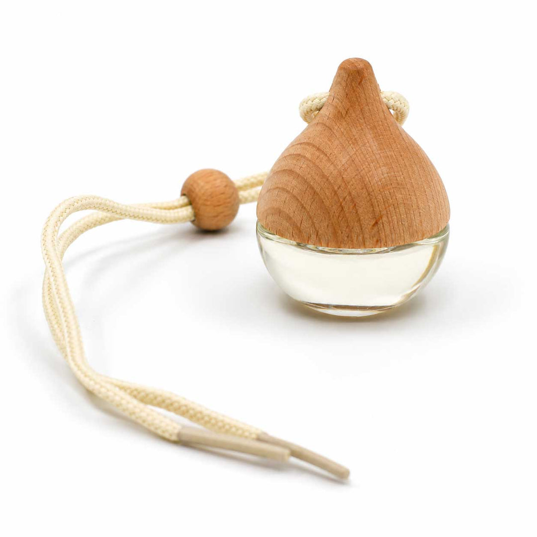 A small teardrop-shaped wooden diffuser or ornament with a clear glass base, cream braided cord, and a round wooden bead, photographed on a white background.