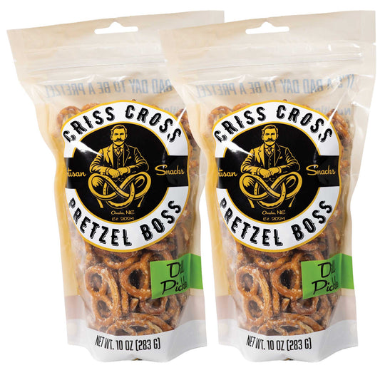 Two packages of Criss Cross Pretzel Boss Pretzels on a white background