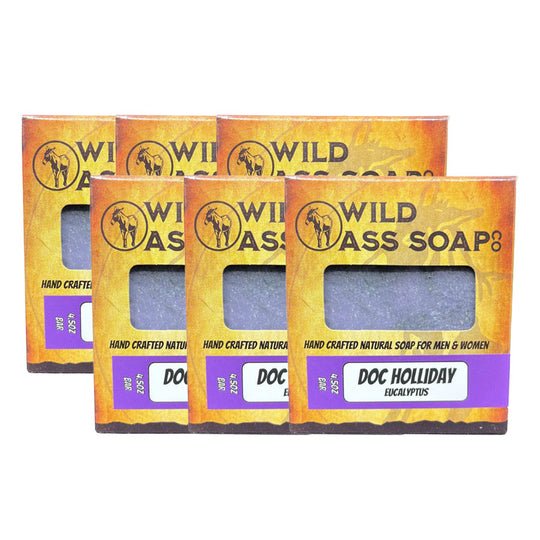 Multiple bars of Wild Ass Soap with packaging on a white background