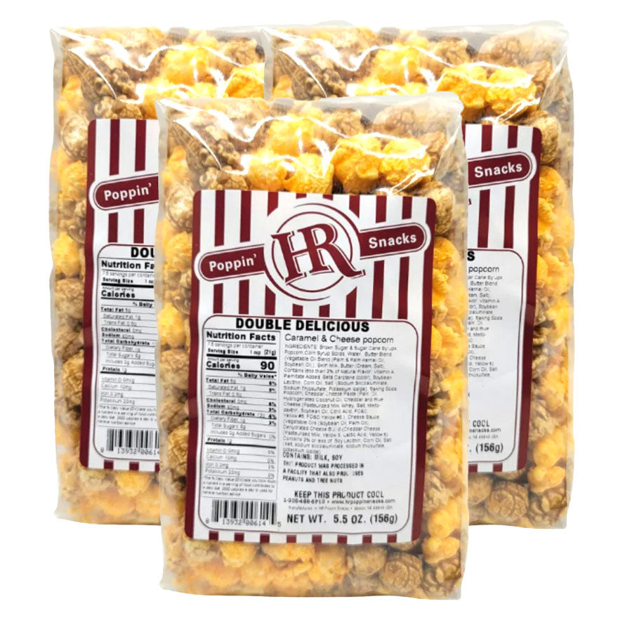 Three bags of popcorn with visible labels on a white background