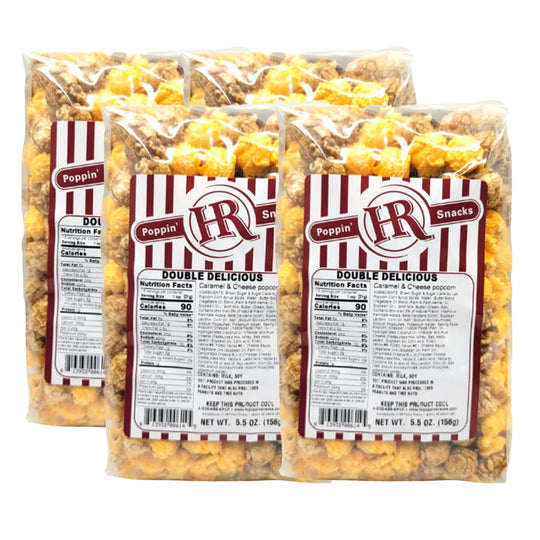 Four bags of HR Poppin' Snacks Double Delicious popcorn on a white background