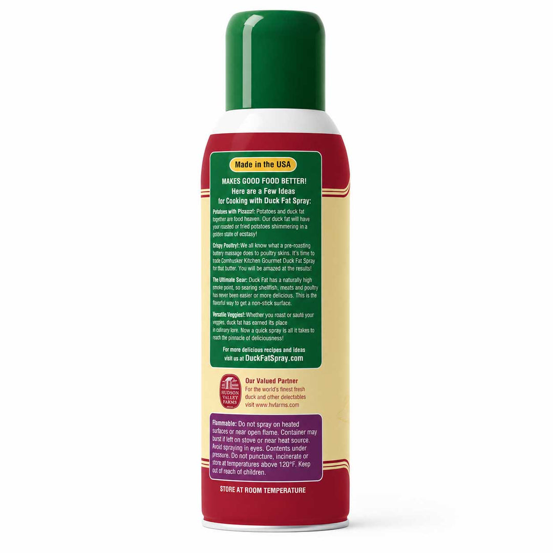 A 16 oz can of Duck Fat Spray with a green cap, white middle section, and red and beige label. The back of the label features a green informational panel with white text, and a purple panel at the bottom.