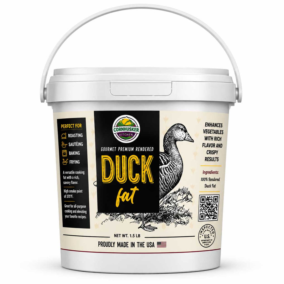 A 15 lb bucket of Commihawk Premium Rendered Duck Fat on a clean white background. The white plastic tub features a detailed label with a black and beige design, showing a detailed illustration of a duck, yellow text, and product details.