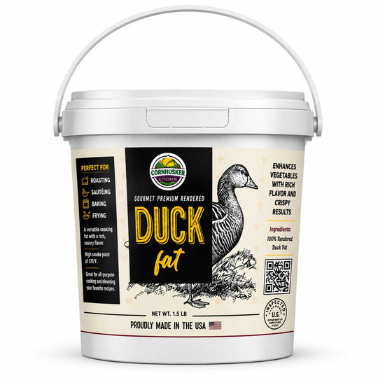 A 15 lb bucket of Commihawk Premium Rendered Duck Fat on a clean white background. The white plastic tub features a detailed label with a black and beige design, showing a detailed illustration of a duck, yellow text, and product details.