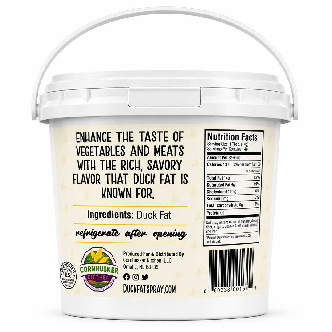A white plastic tub of Duck Fat Spray with a white handle, showing the back label with product information, ingredients, and a barcode on a white background.