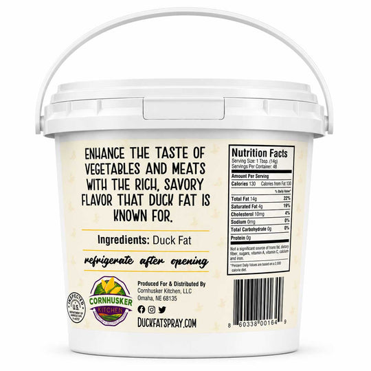 A white plastic tub of Duck Fat Spray with a white handle, showing the back label with product information, ingredients, and a barcode on a white background.
