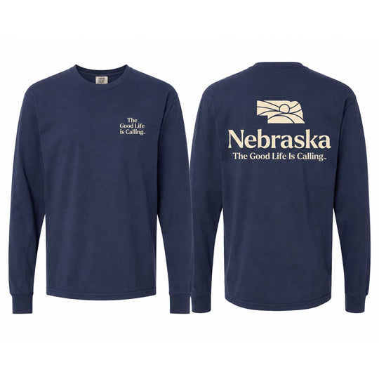 Front and back views of a navy blue long-sleeve t-shirt. The front features a small cream-colored text graphic on the left chest reading 'The Good Life is Calling.