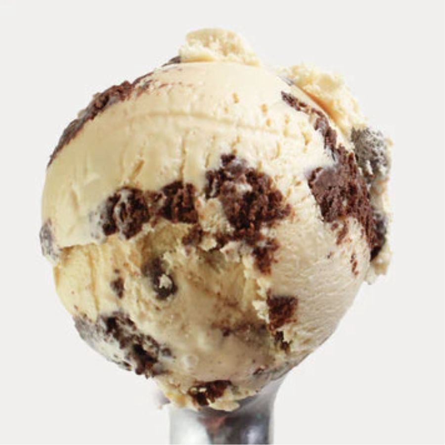 A scoop of Sea Salt Caramel Brownie Ice Cream on a white background