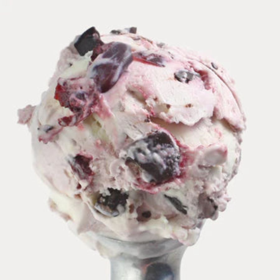 A scoop of Cherry Chocolate Chunk Ice Cream on a white background