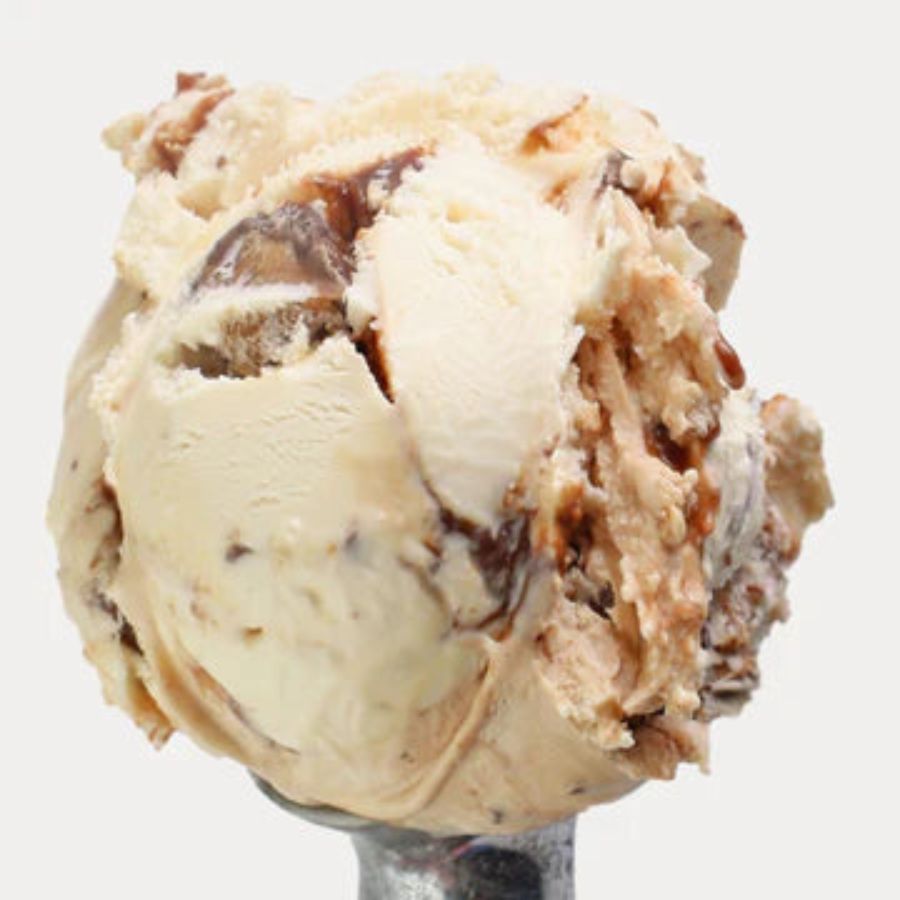 A scoop of Peanut Butter Cup Ice Cream on a white background