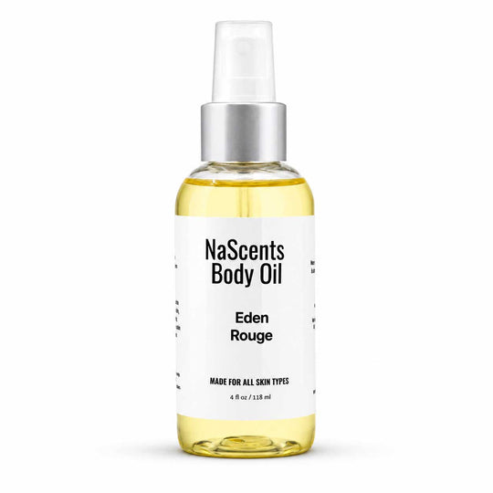 A bottle of NaScents Body Oil in the Eden Rouge scent, featuring a clear glass bottle filled with pale yellow oil, a white label with black text, and a silver pump dispenser, set against a plain white background.