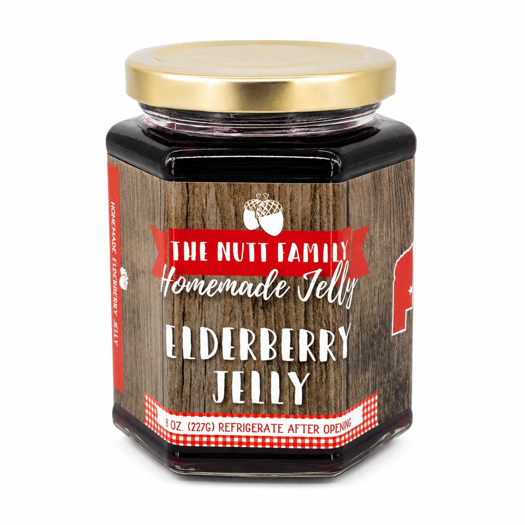 Jar of Elderberry Jelly with a wooden design and gold lid on a white background