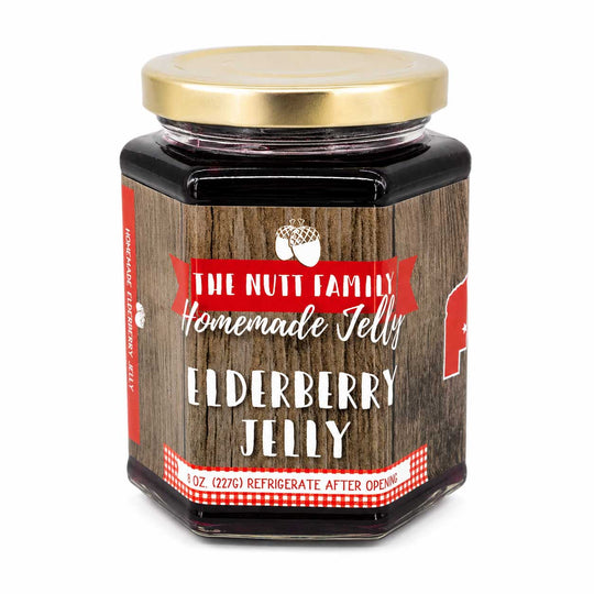 Jar of Elderberry Jelly with a wooden design and gold lid on a white background