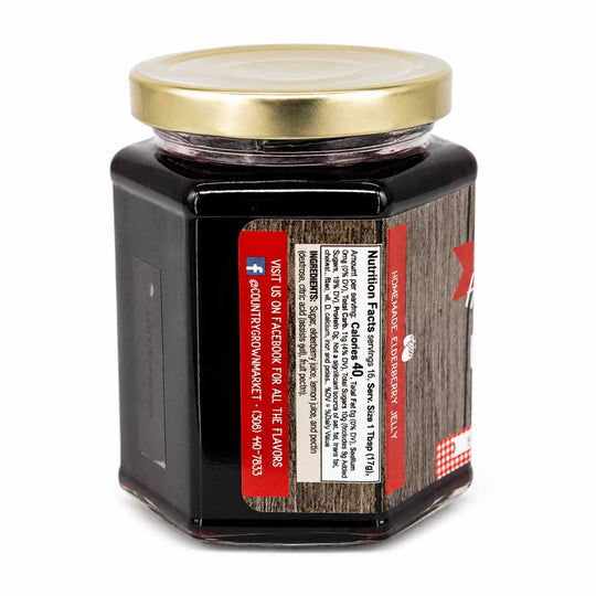 Jar of jelly with a gold lid on a white background