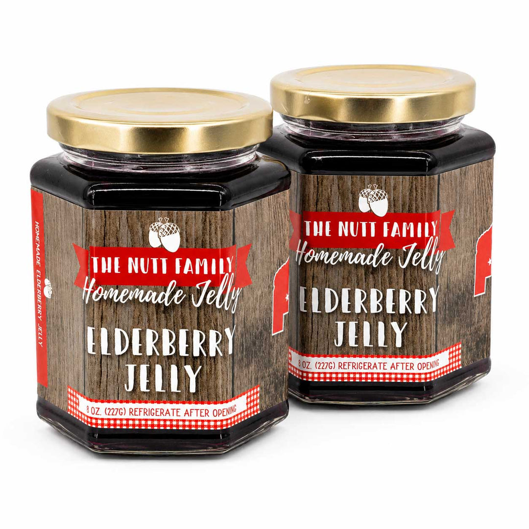 Two jars of Elderberry Jelly with wooden design labels on a white background