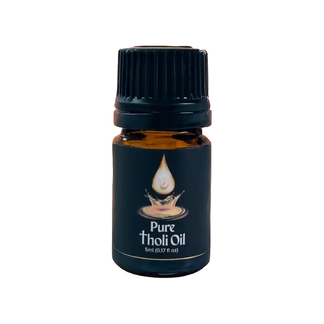 Bottle of Pure Tholi Oil with a black cap on a white background