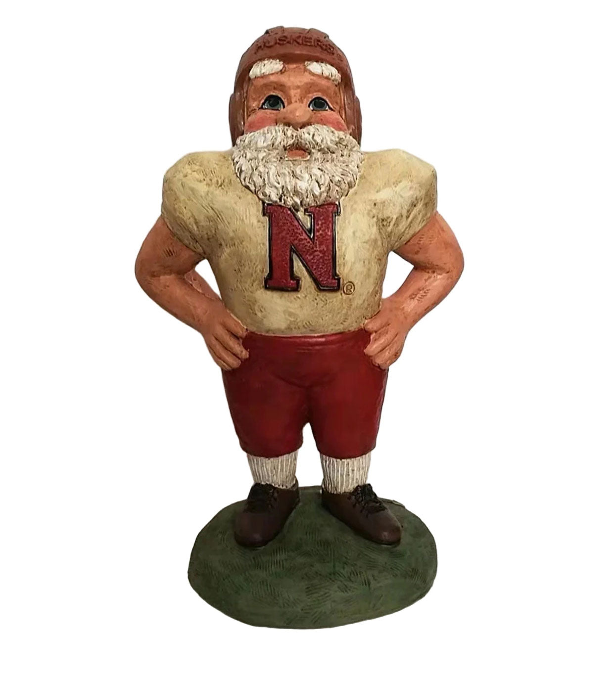 Statue of a football player in a beige jersey with a red 'N' logo and red pants on a white background.