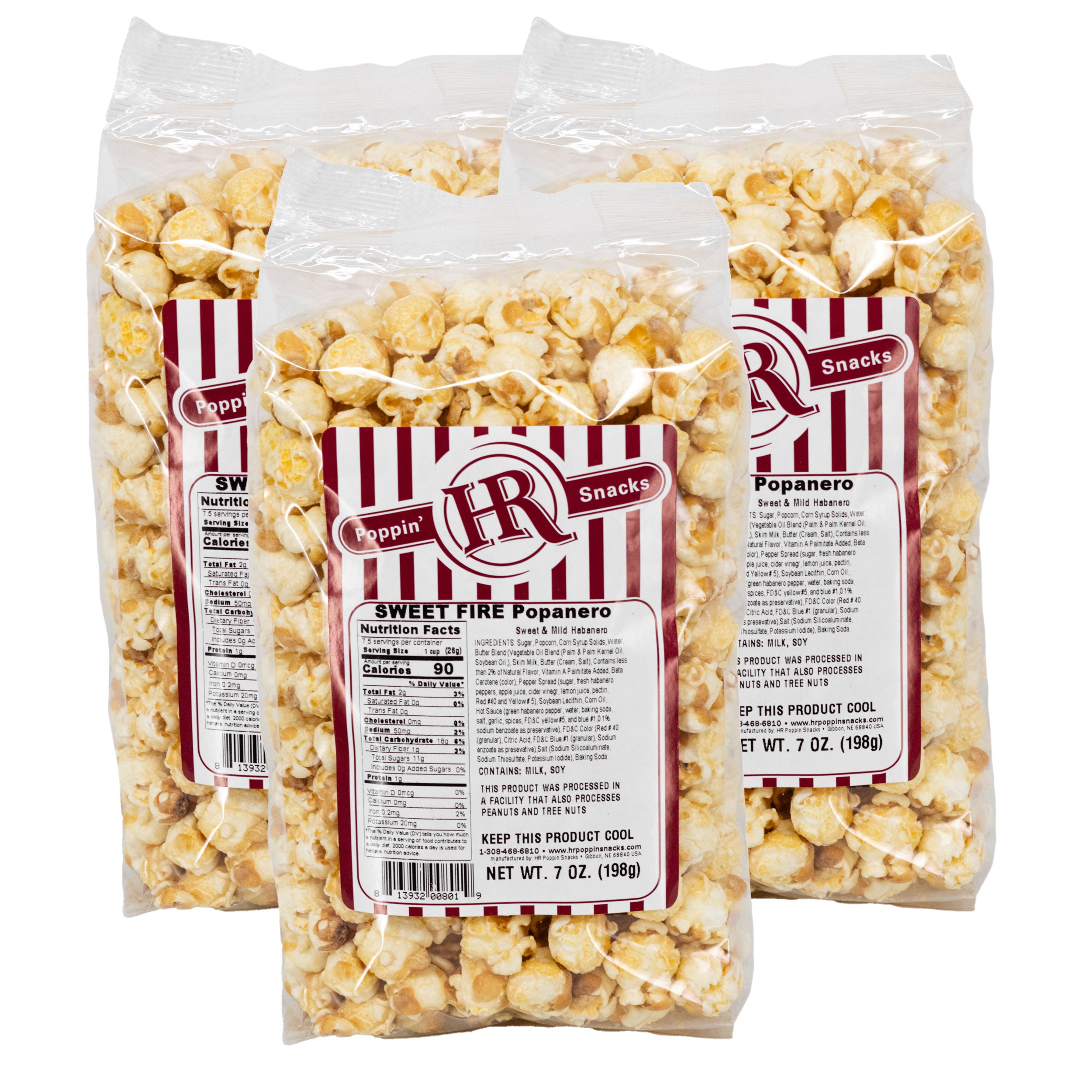 Three packages of sweet fire popanero popcorn with red and white labels on a white background.