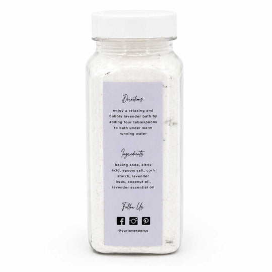 Bottle of bath salts with a label on a white background