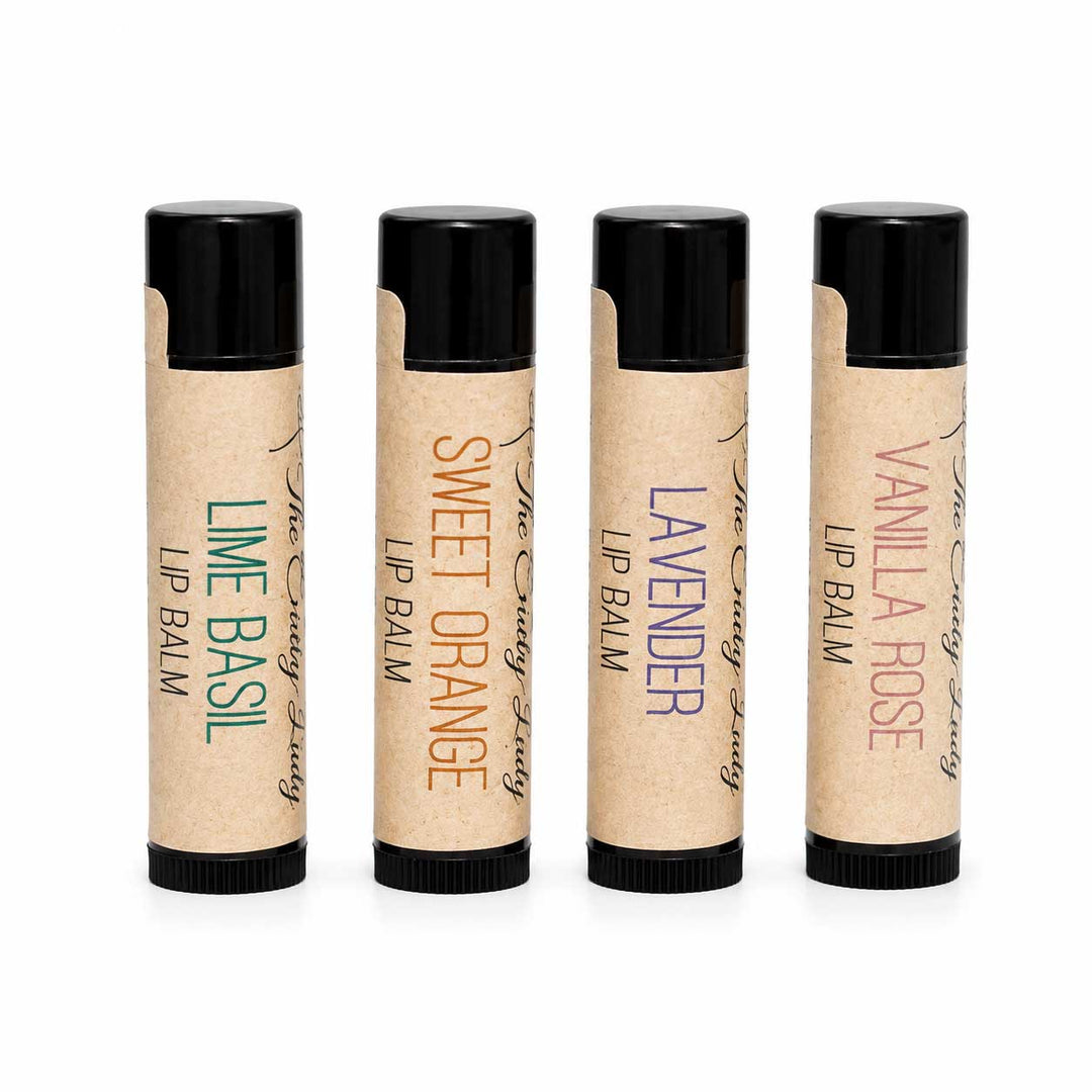 Four lip balm tubes with different scents on a white background