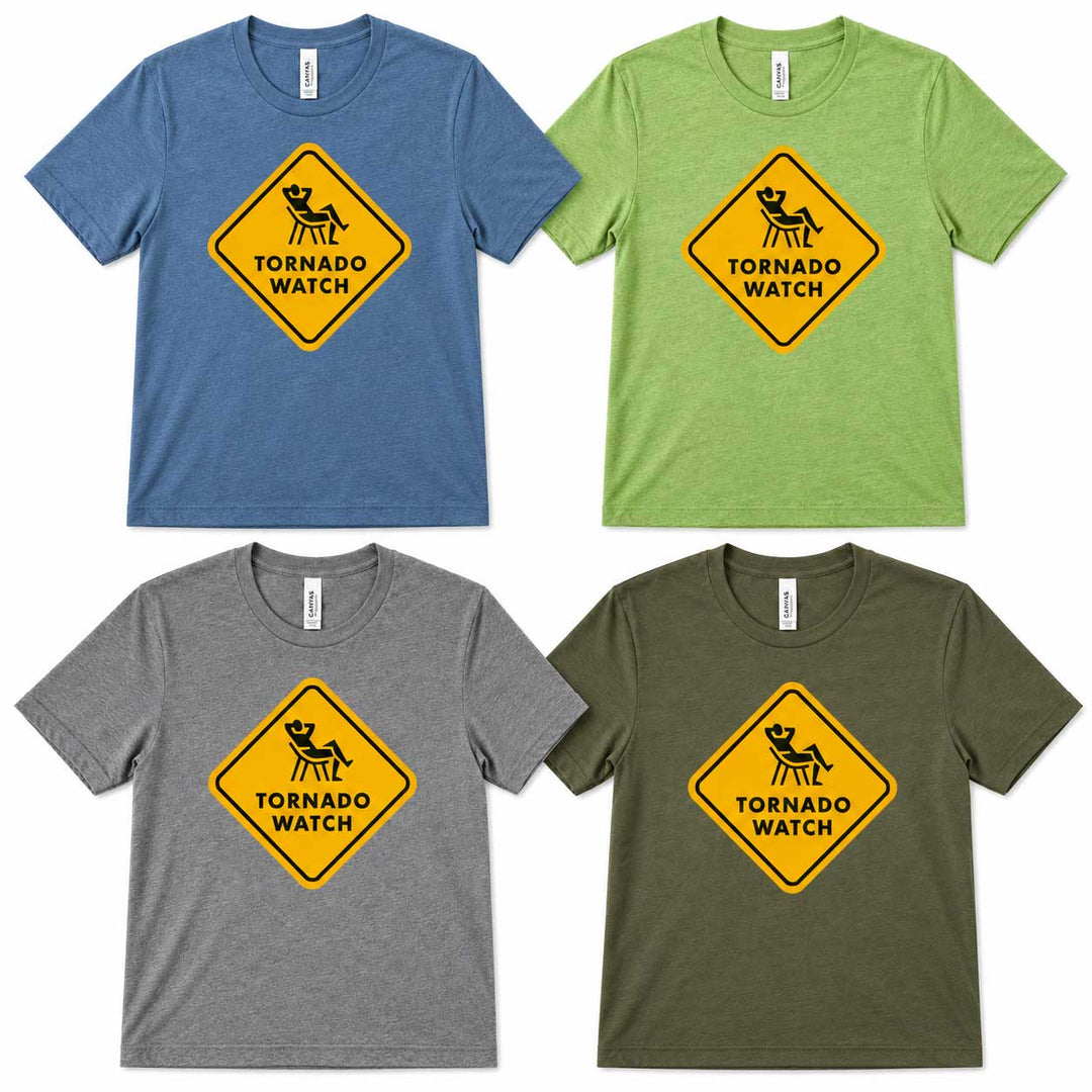 Four short-sleeve crewneck t-shirts shown in blue, green, gray, and olive green, each featuring a yellow diamond-shaped 'Tornado Watch' warning sign graphic on the chest.