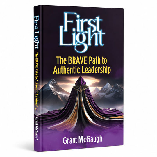 Book titled 'First Light: The BRAVE Path to Authentic Leadership' by Grant McGaugh with a purple and black cover.