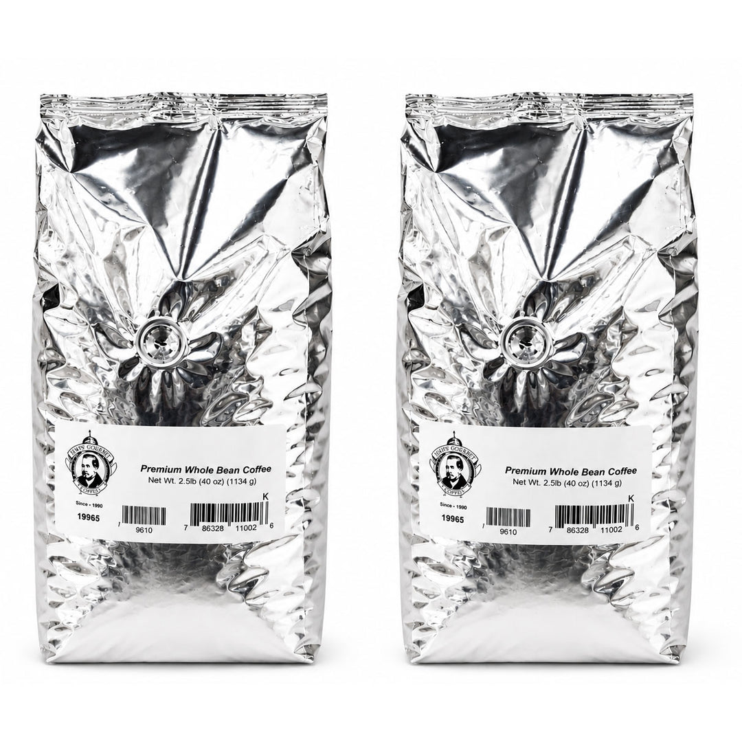 Two packages of premium whole bean coffee with labels on a white background