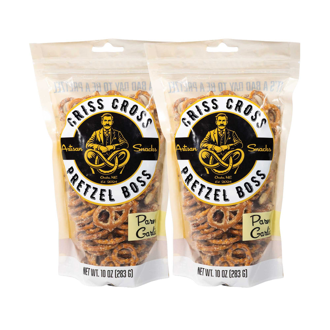 Two packages of Criss Cross Pretzel Boss Parm Garlic pretzels on a white background