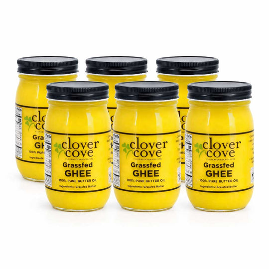 Six jars of Clover Cove Grassfed Ghee on a white background