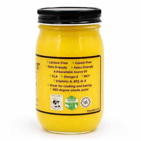 Yellow jar with black lid on a white background