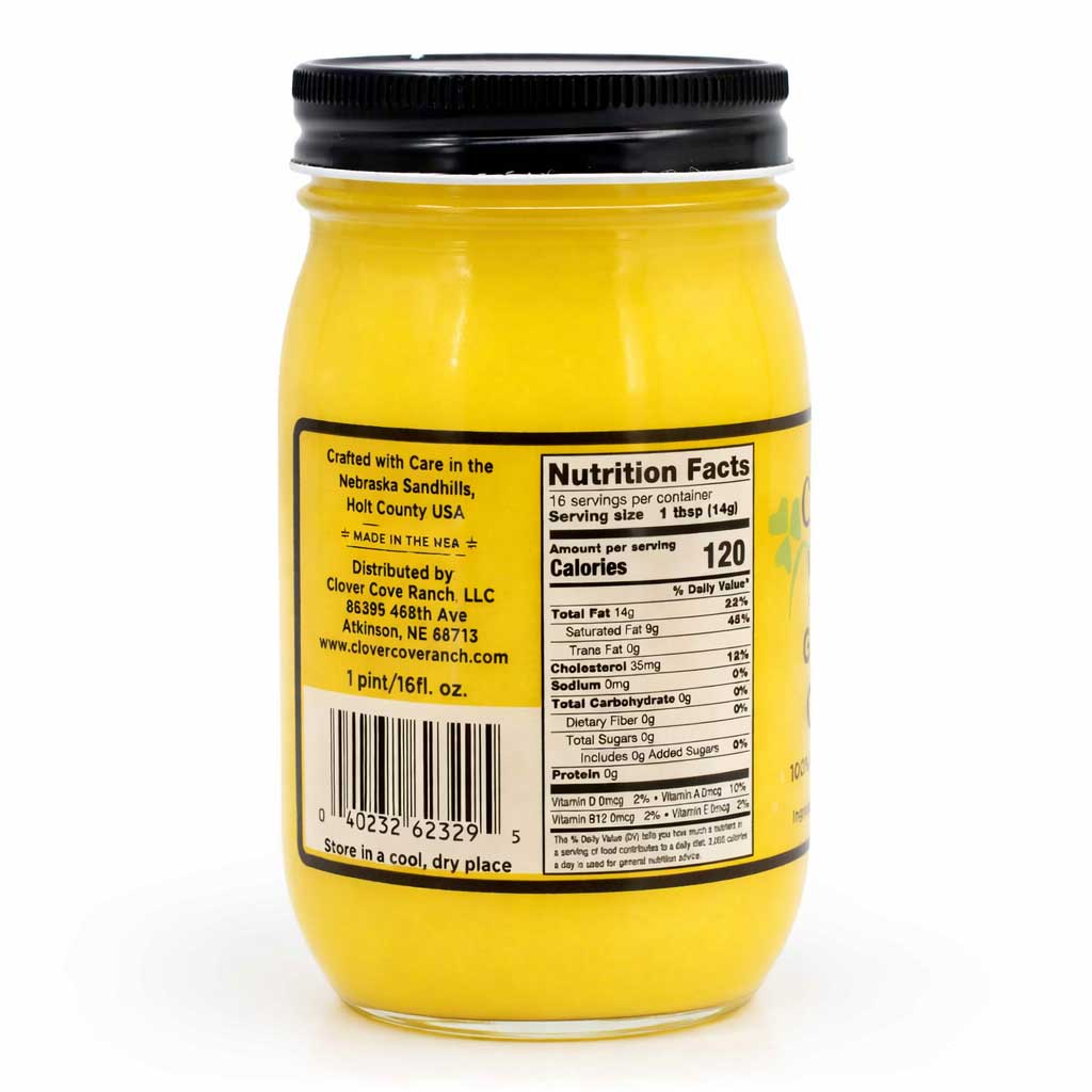 Yellow jar with black lid and nutrition label on a white background