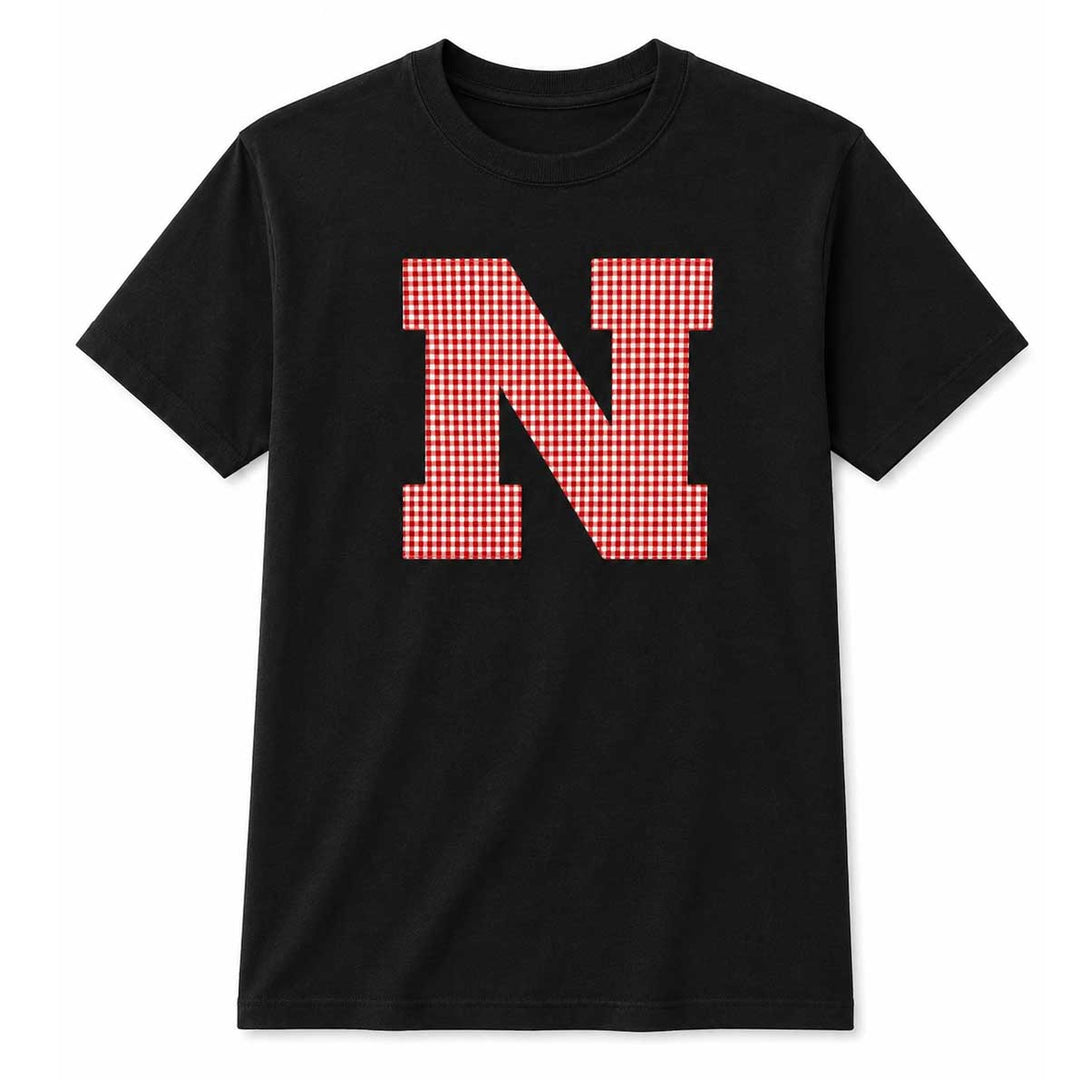 A black short-sleeve crewneck t-shirt featuring a large letter 'N' on the chest filled with a red and white gingham checkered pattern, shown against a plain white background.