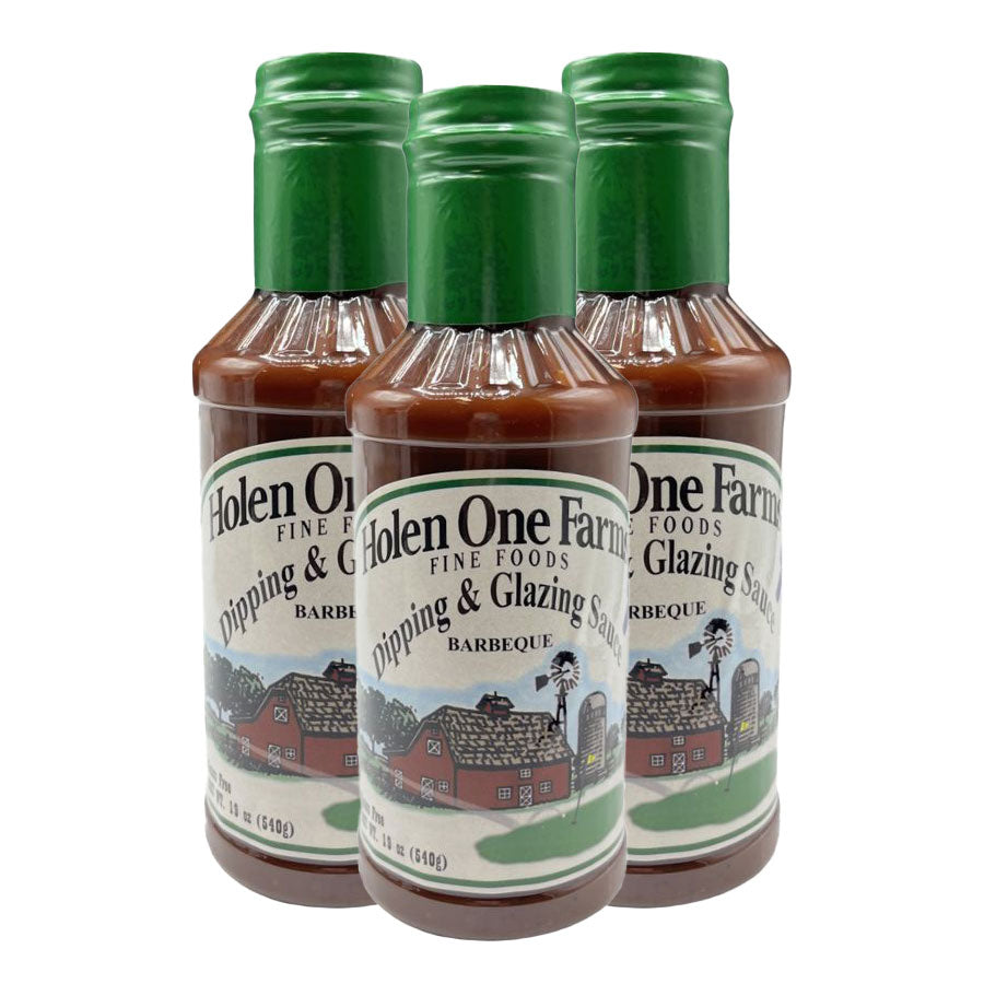 Three bottles of Holen One Farm barbecue sauce with green caps on a white background