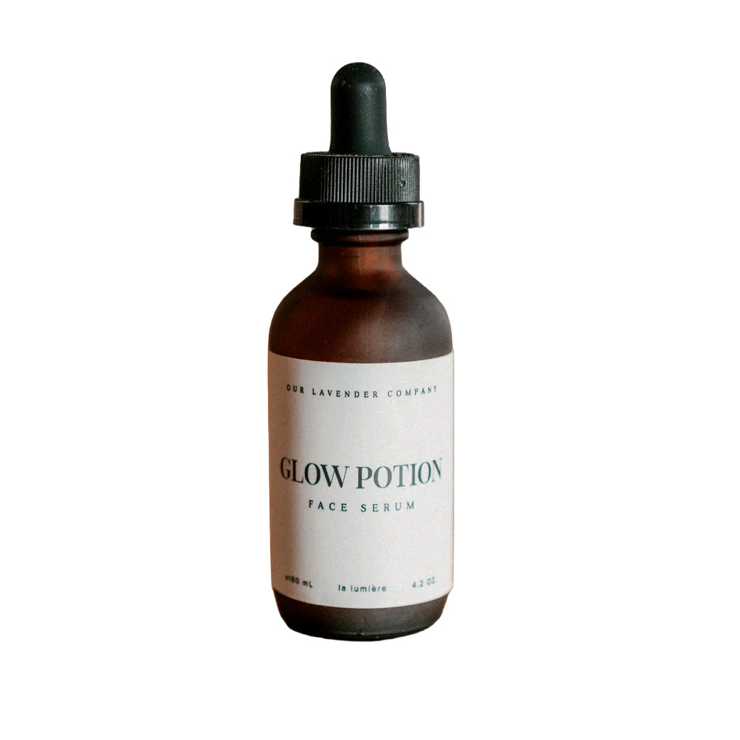 Bottle of 'Glow Potion' face serum with a dropper on a white background