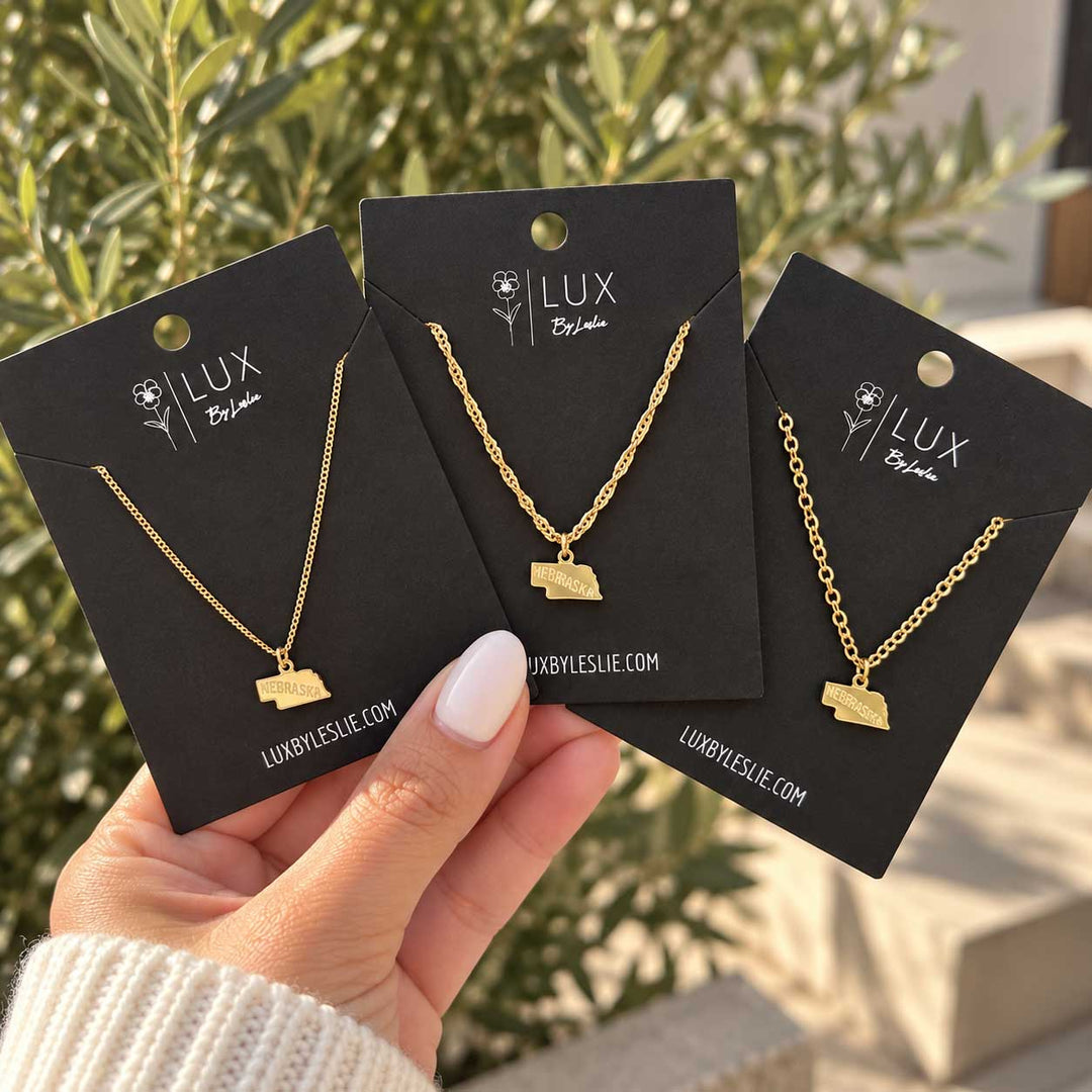 Three Gold Necklaces with Nebraska Pendant